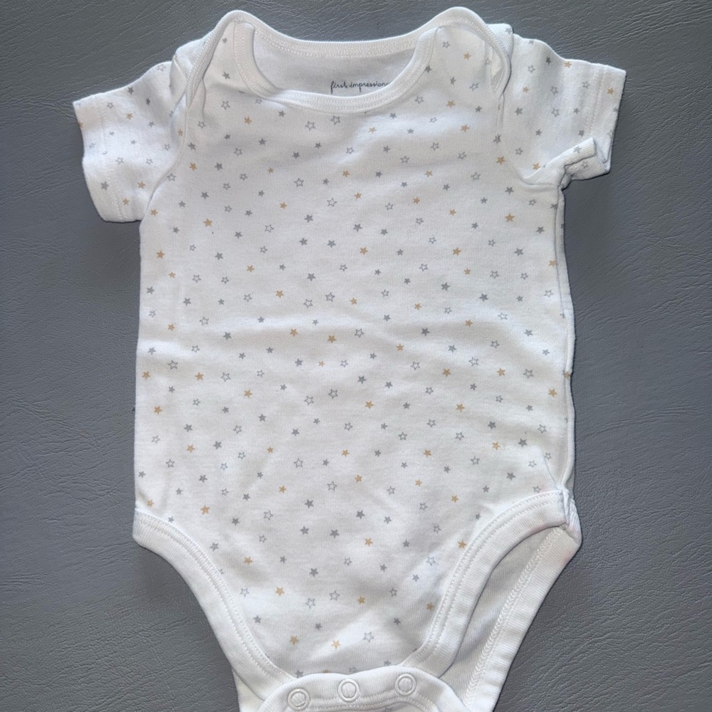 First Impressions White Onesie with Subtle Star Patterns